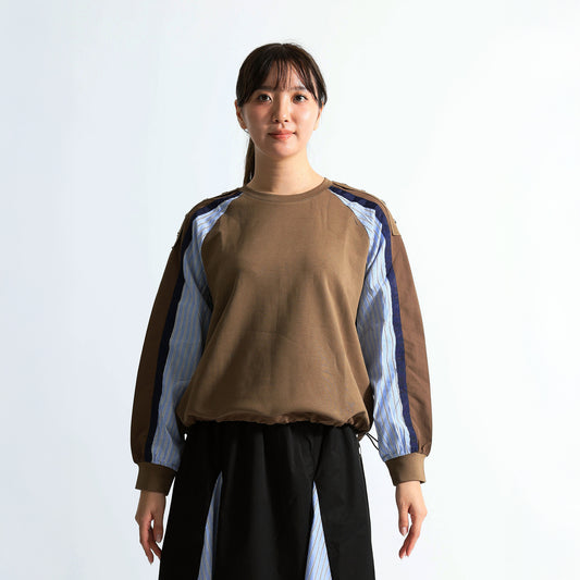 ラグランスリーブと異素材切り替えが特徴的な長袖プルオーバー