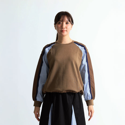 ラグランスリーブと異素材切り替えが特徴的な長袖プルオーバー